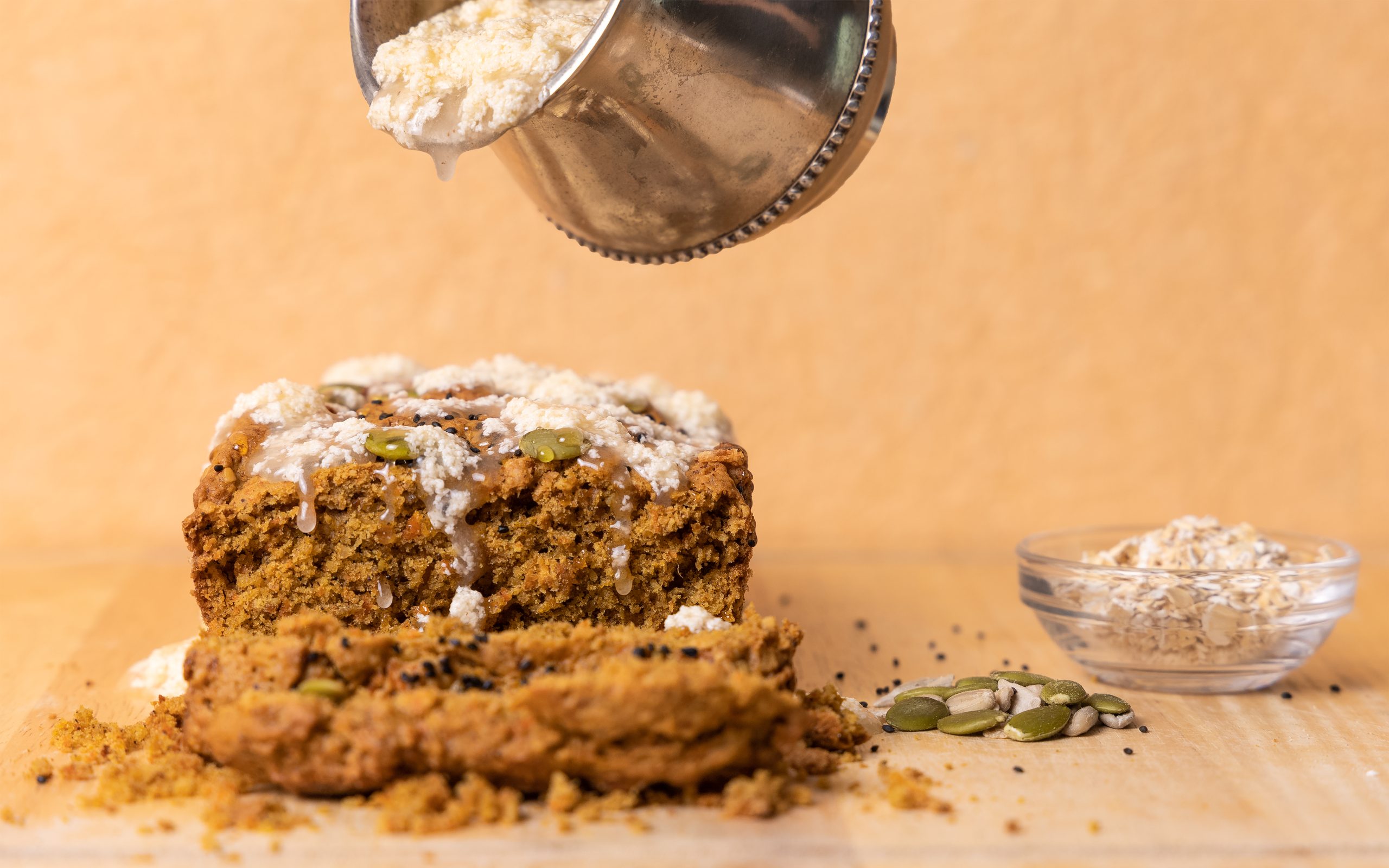 Loaf with flour falling from a sieve