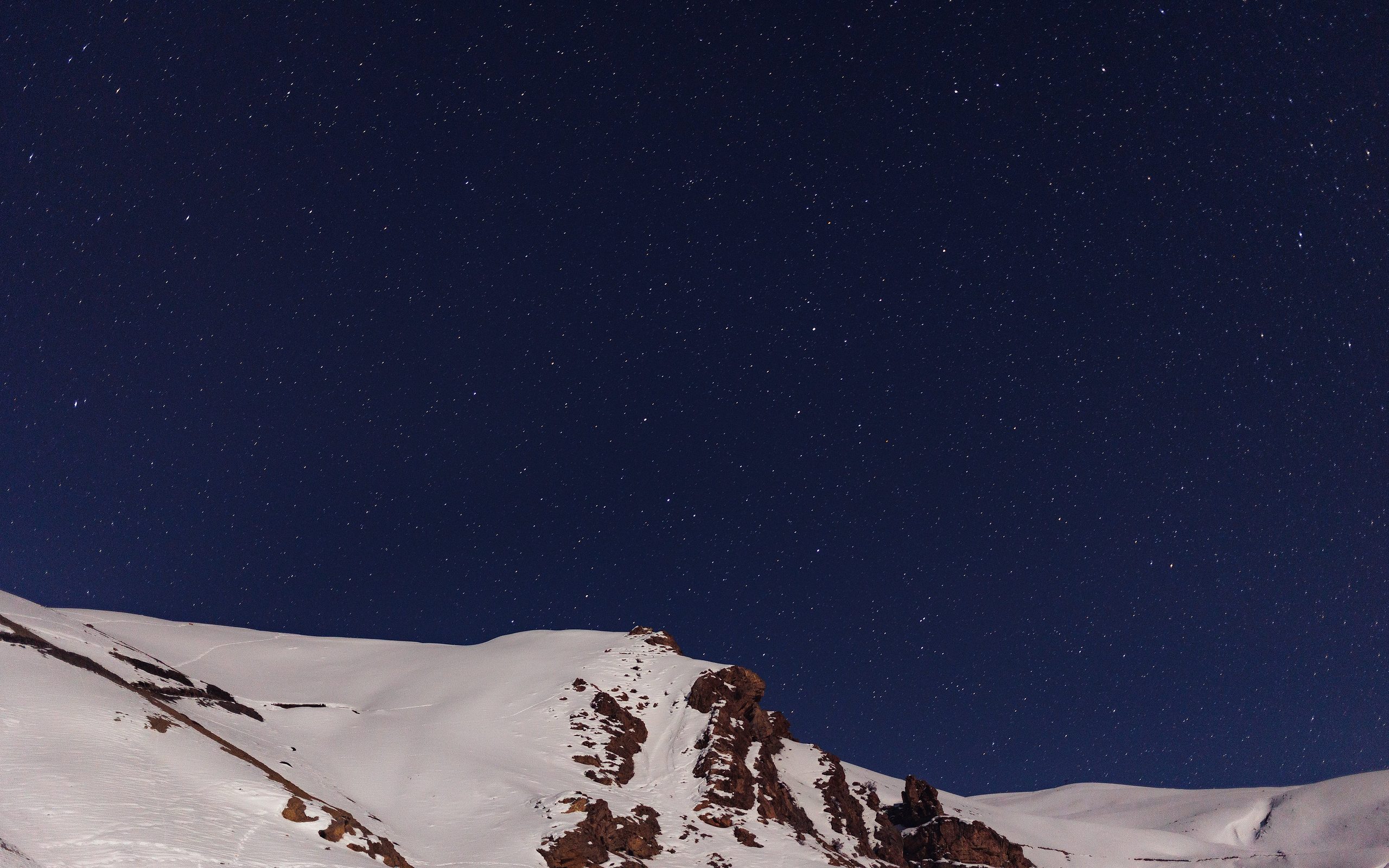 Stars above a snow ridge